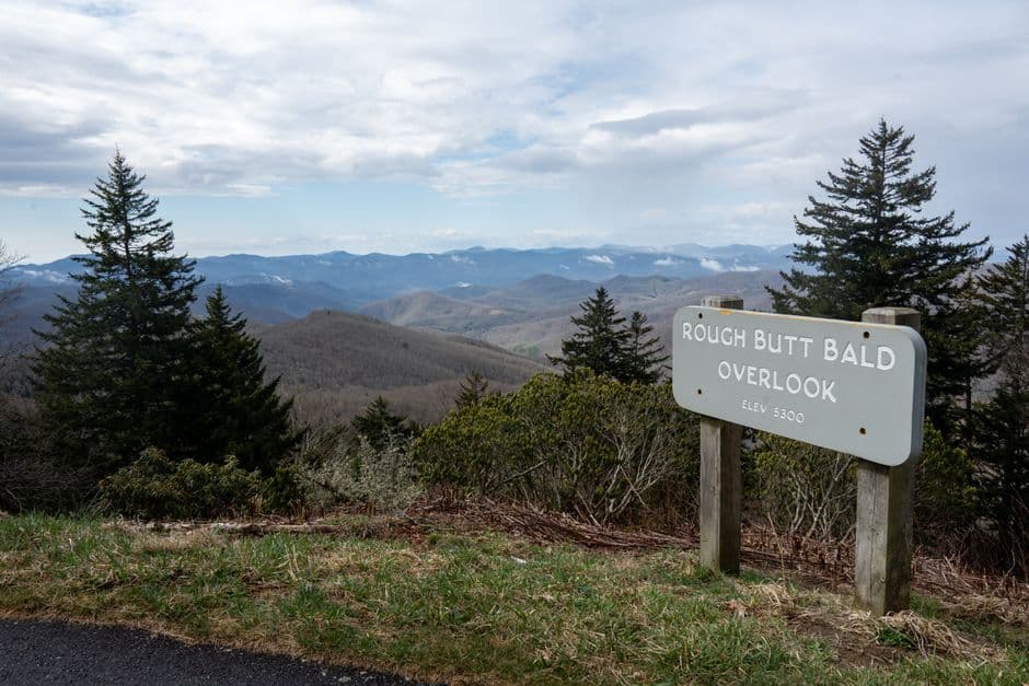Breathtaking view of Blue Ridge Mountains from Rough Butt Bald Overlook on a sunny day.